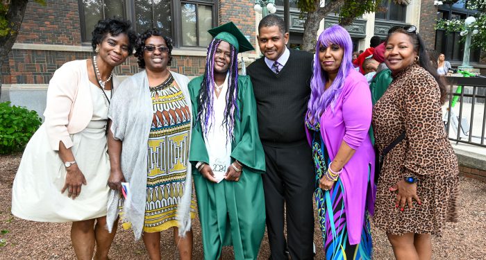 Graduates with their families outside after the ceremony.