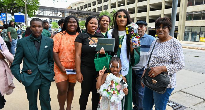 Graduates with their families outside after the ceremony.
