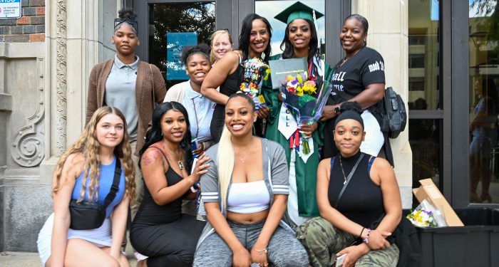 Graduates with their families outside after the ceremony.