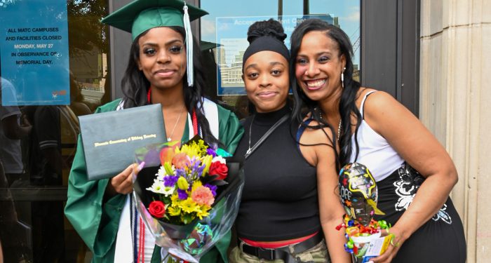 Graduates with their families outside after the ceremony.