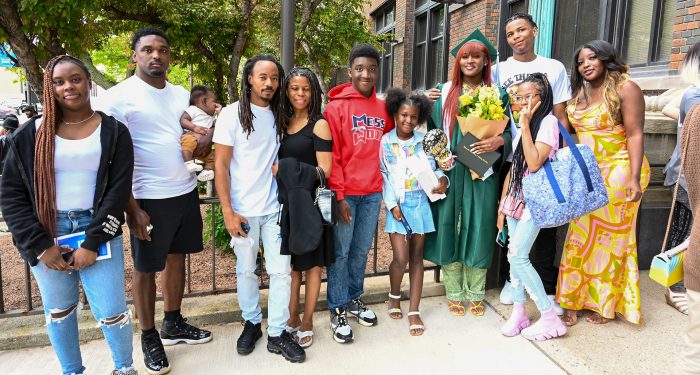 Graduates with their families outside after the ceremony.