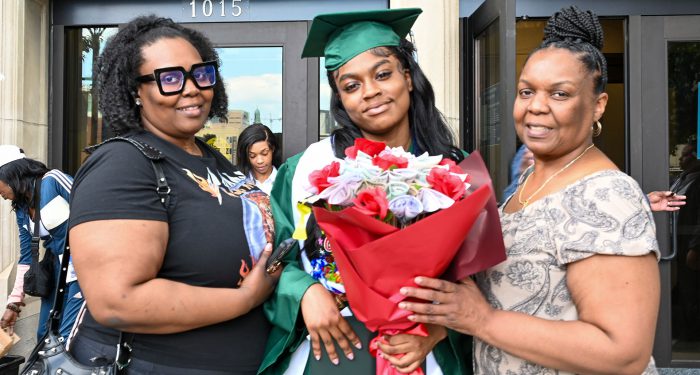 Graduates with their families outside after the ceremony.