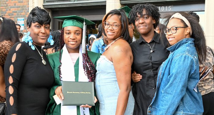 Graduates with their families outside after the ceremony.