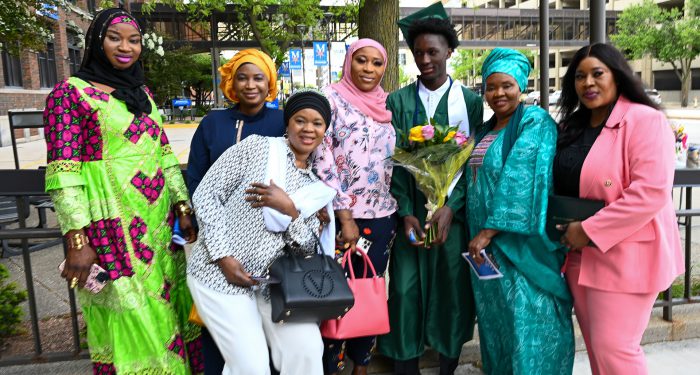 Graduates with their families outside after the ceremony.
