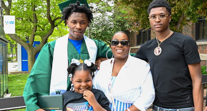 Graduates with their families outside after the ceremony.