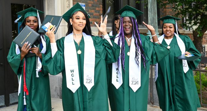Graduates celebrating outside after the ceremony.