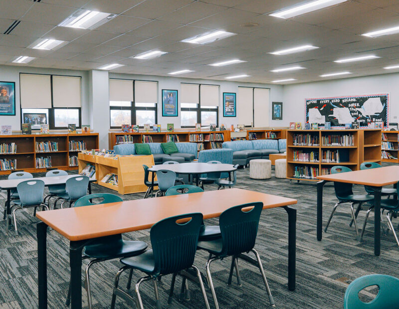 A brightly lit school library.