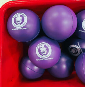Close-up of a bucket of stress balls.